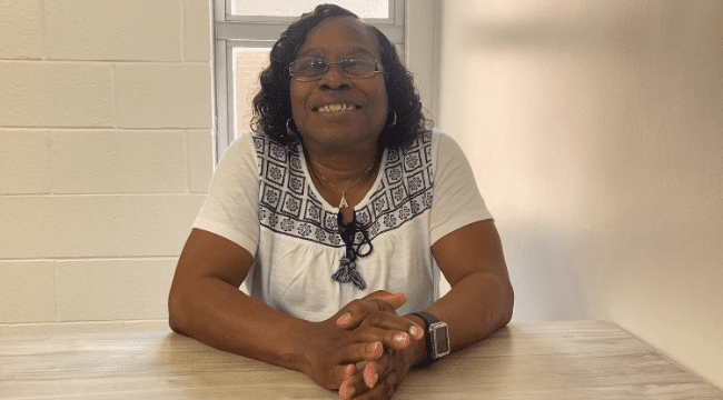 BCBDD Arnetta Johnson smiling at a table