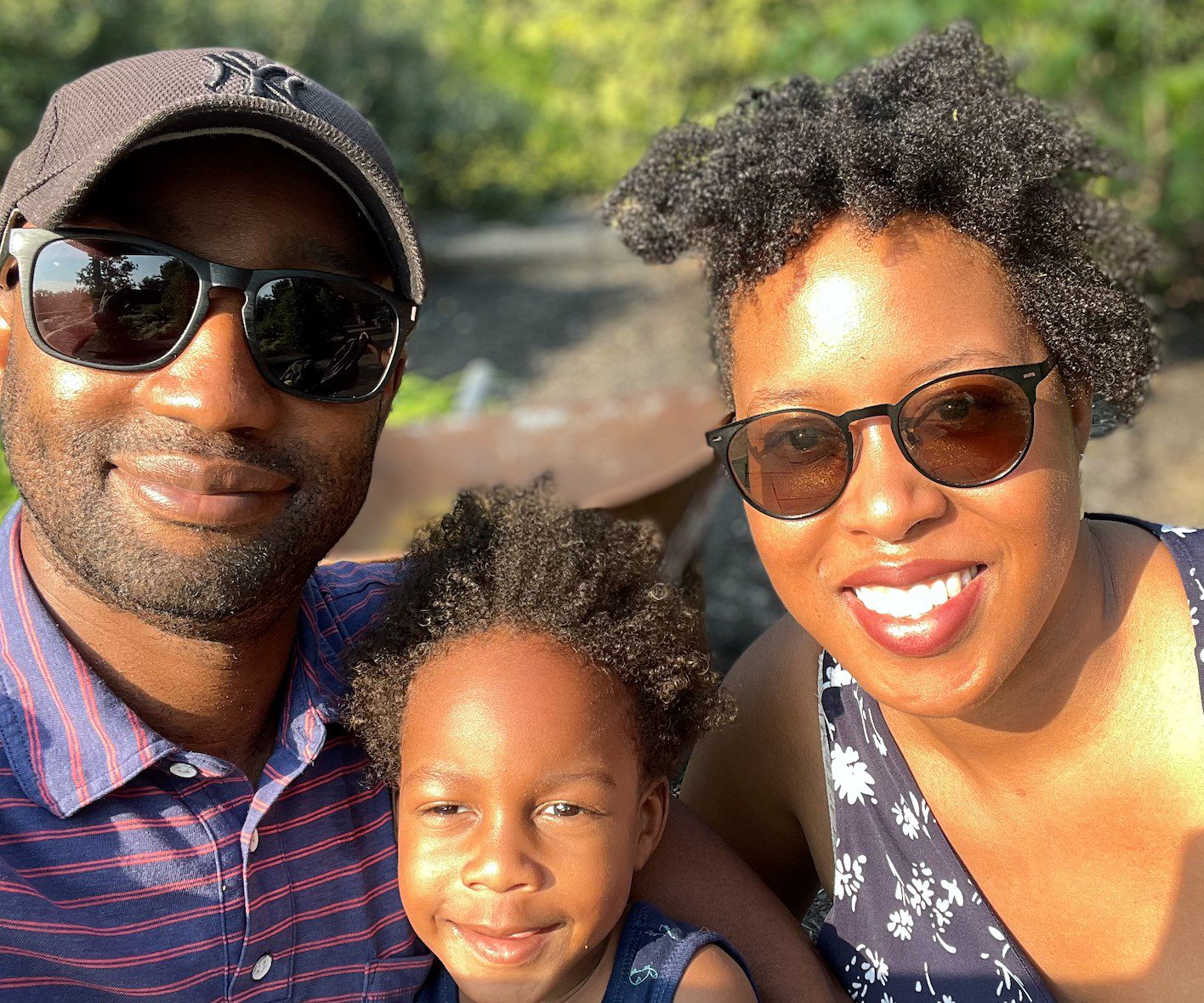 A Family smiling together for a photo