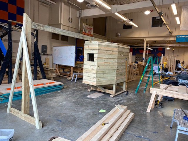 A wooden playset being assembled