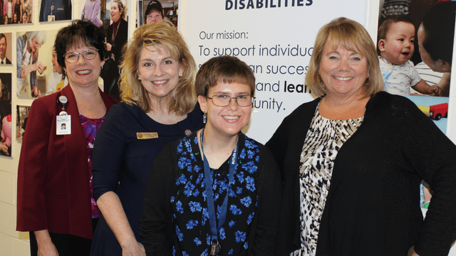 Four professionally dressed women smile at the camera. From left, they are Lisa Guliano, Representative Jennifer Gross, Courtney Hineman, Connie Mehlman