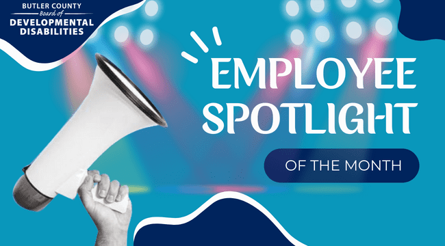 A graphic with a megaphone and colored spotlights that read, "Employee Spotlight of the Month."