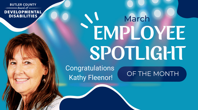 A graphic with a spotlight and a woman with text that reads, "March Employee Spotlight of the month, Congratulations, Kathy Fleenor!"