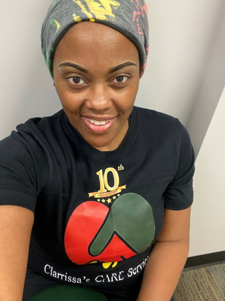 A headshot of a woman smiling with a shirt on that says Clarrissa's Care Services