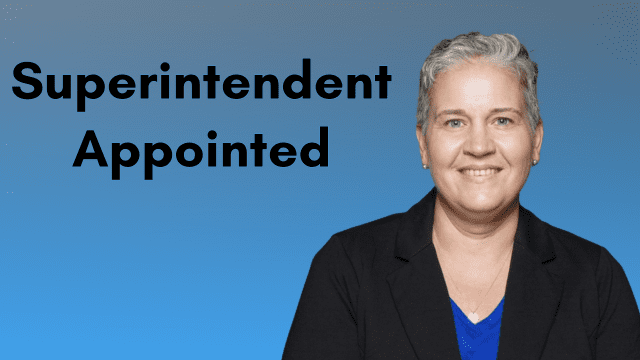Image shows woman on blue background with text that reads Superintendent Appointed