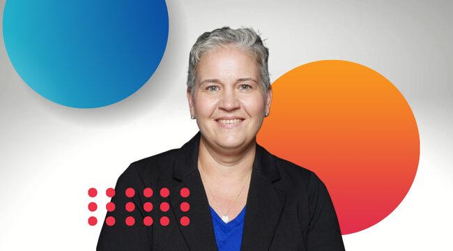 A woman smiles with blue, orange, and red circles in the background and foreground. The circles match the theme of the Board and the Board's website.