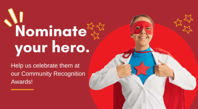 Image shows a woman wearing a blouse. She is pulling her shirt apart and under her blouse is a superhero uniform. Text on the image says Nominate your hero.